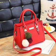 Black Women's Fashion Handbag with Pom Pom Charm