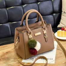Black Women's Fashion Handbag with Pom Pom Charm