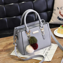 Black Women's Fashion Handbag with Pom Pom Charm