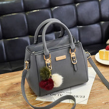 Black Women's Fashion Handbag with Pom Pom Charm